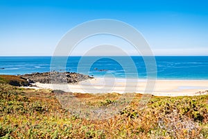 Beach Pit on Breton coastline in France Frehel Cape region with its sand, rocks and moorland in summer