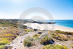 Beach Pit on Breton coastline in France Frehel Cape region with its sand, rocks and moorland in summer