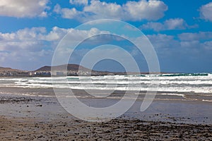 The beach Playa de la Caleta de Famara is located in the northwest of the popular Canary Islands holiday island of Lanzarote photo