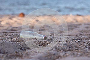 Beach pollution. Plastic bottles and other trash on sea beach. Ecological concept. earth day concept. globe pollution. Garbage on