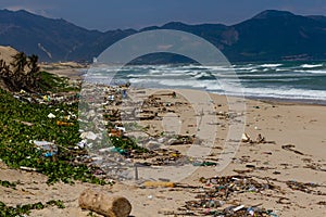 Beach pollution, plastic and waste from ocean on the beach