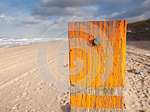 Beach post with sea level marker