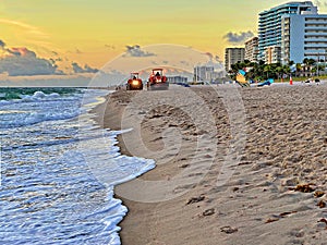 Beach Raker smoothing sand at dawn