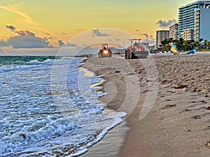 Beach Raker smoothing sand at dawn