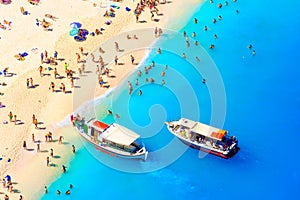 Beach recreation. The sea bay. Clear turquoise water and boats. View from the air. Summer landscape from a drone.