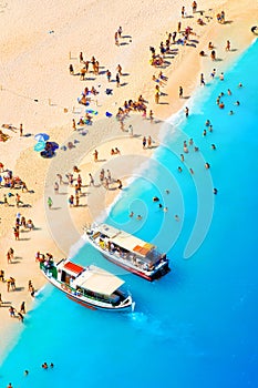 Beach recreation. The sea bay. Clear turquoise water and boats. View from the air. Summer landscape from a drone.