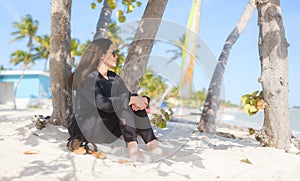 Beach Relaxation Woman Enjoying Serenity under Palm Tree on Smathers Beach in Key West, FL Florida