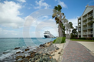 Beach Resort with stone walkway and view of the cruise port in Aruba.