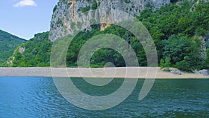 beach by the river in the Ardeche France Pont d Arc, Ardeche France,view of Narural arch in Vallon Pont D'arc in