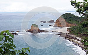 Beach and rock in Machalilla National Park - Puerto Lopez - Ecuador photo