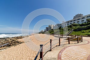 Beach rocks ocean waves blue coastal city skyline