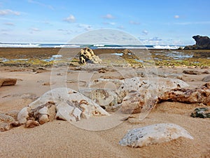 A beach with rocks and sand beach background