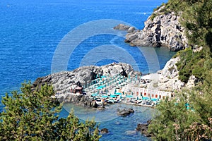 Beach between the rocks in Talamone, Italy