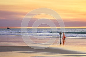Beach Romantic Young Couple Walking Edge of Sea at Sunset
