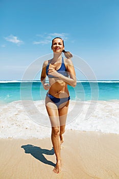 Beach Run. Fitness Woman In Bikini Running In Summer