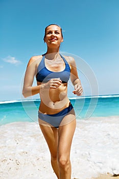 Beach Run. Fitness Woman In Bikini Running In Summer