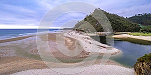 Beach of San AntolÃÂ­n, Naves, Spain photo