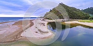 Beach of San AntolÃÂ­n, Naves, Spain photo