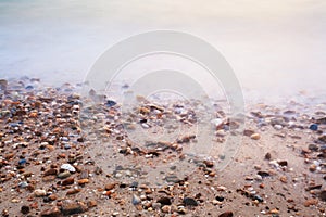 Beach sand background with pebbles