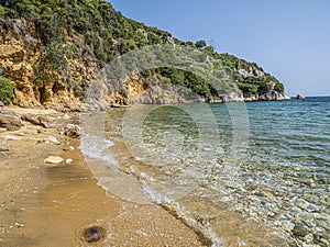 Beach sand and beautiful blue sea view. Natural living. Pelion peninsula. Pagasetic gulf. Platanias village. Greece.