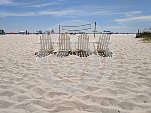 Beach chairs volleyball net