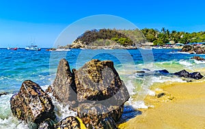 Beach sand blue turquoise water waves rocks panorama Puerto Escondido