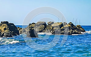 Beach sand blue turquoise water waves rocks panorama Puerto Escondido