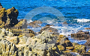 Beach sand blue turquoise water waves rocks panorama Puerto Escondido