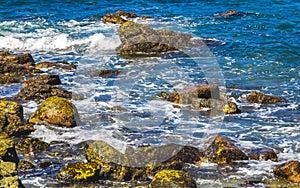 Beach sand blue turquoise water waves rocks panorama Puerto Escondido