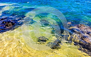 Beach sand blue turquoise water waves rocks panorama Puerto Escondido photo