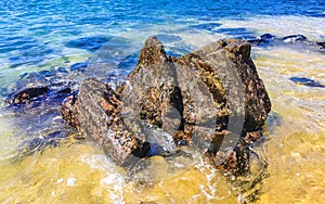 Beach sand blue turquoise water waves rocks panorama Puerto Escondido photo