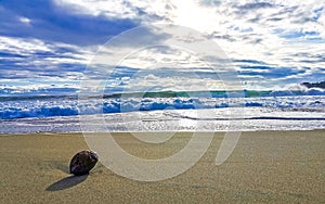 Beach sand blue water huge surfer waves Puerto Escondido Mexico