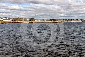 Beach with sand and buildings in Galway Bay