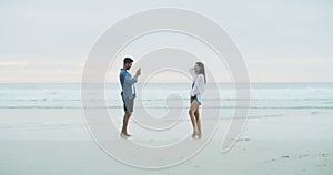 Beach sand, cellphone photo and ocean couple, husband and wife pose for memory picture. Phone photography, sea wave and