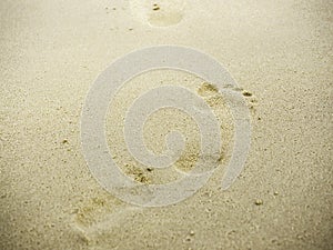 Beach sand footprints with copy space.