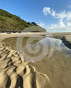 A beach and sand ripples at low tide on the Gold Coast in Queensland, Australia