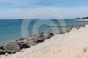 Beach sand with rocks in island of Noirmoutier in Vendee France