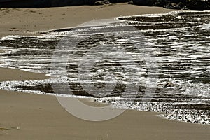 Beach Sand shore waves water ocean on greek island kalymnos