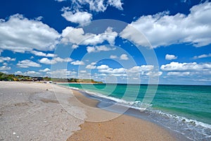 Beach sand and sky with clouds