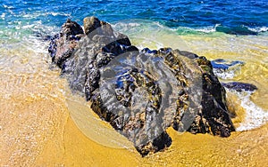 Beach sand blue turquoise water waves rocks panorama Puerto Escondido photo