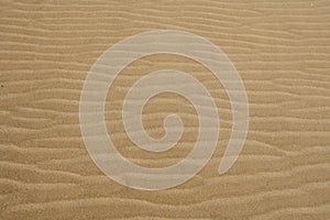 Beach sand waves warm texture background