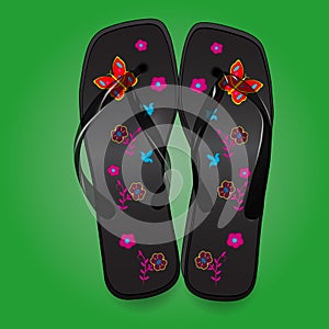 Beach sandals, black flip flops with a bright pattern on green b