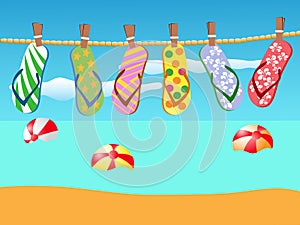 Beach sandals hanged on a rope