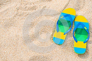 Beach sandals on the sandy coast