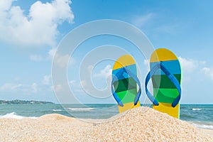 Beach sandals on the sandy coast