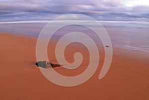 Beach scene with colourful overcast sky