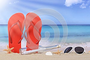 Beach scene with flip flops sandals and bottle post in summer va