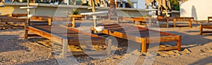 beach scene in Side Turkey with empty umbrellas and sun loungers. Vacation at the sea. Summer holidays.