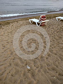 Beach scene after sunset. Beach loungers on the Black Sea coast. HDR Mobile photography