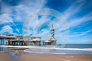 The beach of Scheveningen overlooking the old pier with bungy-tower